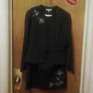 A gray 2 piece skirt suit.